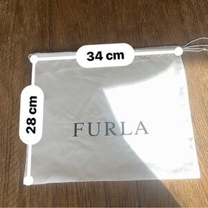 Furla White Logo Dust Bag. There are some minor smudges from the black lettering